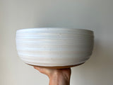 speckled matte white serving bowl